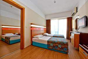 Postel nebo postele na pokoji v ubytování Sultan Sipahi Resort Hotel