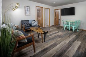 a living room with a couch and a table at Washington Park Place in Portland