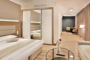 Postel nebo postele na pokoji v ubytování Ocak Aparthotel + 37 fotografií