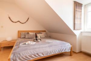 a bedroom with a bed in a attic at Ferienwohnung-7-Auszeit-in-der-Villa-Annabelle in Binz