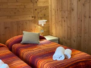 Postel nebo postele na pokoji v ubytování Sottosopra Alps Apartments & Rooms