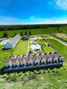 an aerial view of a resort with a pool at Apartmenty Magnolia in Łeba