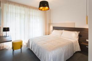Postel nebo postele na pokoji v ubytování Enjoy Duomo - Flavio Baracchini 9 - Rooms
