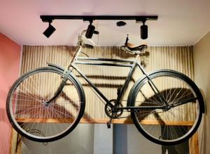 a bike hanging on a shelf in a room at House Bike Sonora in Conservatória