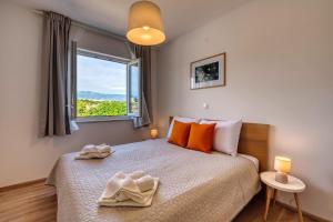 Giường trong phòng chung tại Rock Apartments