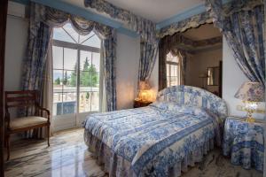 Postel nebo postele na pokoji v ubytování Hotel Hidalgo
