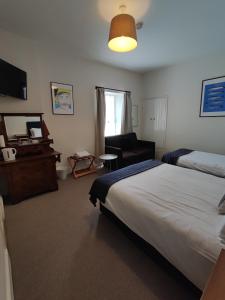 Postel nebo postele na pokoji v ubytování Rolling Wave Guesthouse