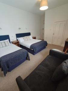 Postel nebo postele na pokoji v ubytování Rolling Wave Guesthouse
