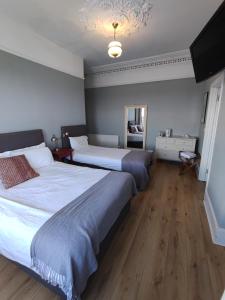Postel nebo postele na pokoji v ubytování Rolling Wave Guesthouse