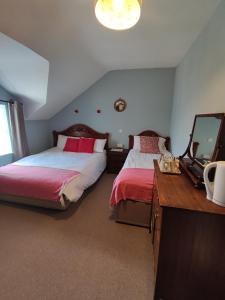 Postel nebo postele na pokoji v ubytování Rolling Wave Guesthouse