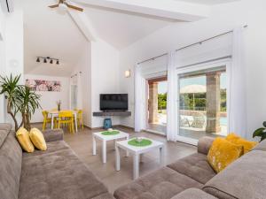 a living room with a couch and a table at Holiday Home Mario by Interhome in Svetvinčenat