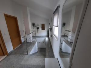 an empty room with stairs in a building at Ojdana Živković in Rogoznica