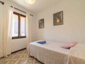 Ein Bett oder Betten in einem Zimmer der Unterkunft Villa Can Jeroni by Interhome