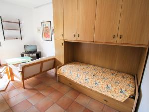a bedroom with a bunk bed in a room at Apartment Residenza Agrifoglio-16 by Interhome in Luino