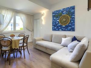 a living room with a couch and a table at Holiday Home Punta 2 by Interhome in Umag