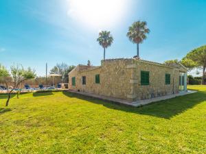 A garden outside Villa Can Delfin Alcudia by Interhome