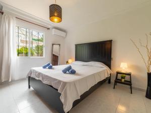 A bed or beds in a room at Villa Can Delfin Alcudia by Interhome