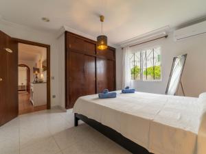 A bed or beds in a room at Villa Can Delfin Alcudia by Interhome
