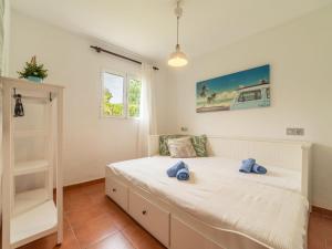 A bed or beds in a room at Villa Can Delfin Alcudia by Interhome