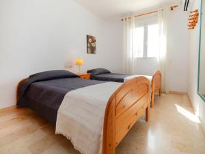 Łóżko lub łóżka w pokoju w obiekcie Holiday Home Villa Cassandra by Interhome