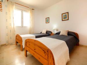 Łóżko lub łóżka w pokoju w obiekcie Holiday Home Villa Cassandra by Interhome