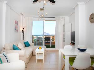 a living room with a couch and a table at Apartment Residencial Jazmines by Interhome in Calpe