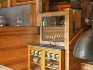 Kuchyň nebo kuchyňský kout v ubytování Holiday Home Kelo tuisku by Interhome