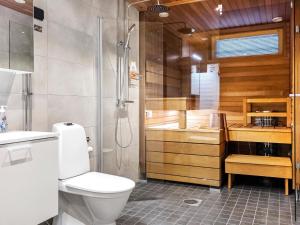 a bathroom with a toilet and a shower and a sink at Holiday Home Levin kunkku dome c5 by Interhome in Sirkka