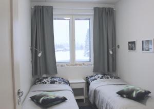 Tempat tidur dalam kamar di Lapland Happiness Skistar 201