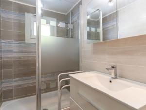 a bathroom with a sink and a shower at Holiday Home Les Trounques-1 by Interhome in Mimizan