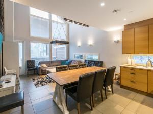 a kitchen and living room with a table and chairs at Holiday Home Ritari by Interhome in Pälkäne