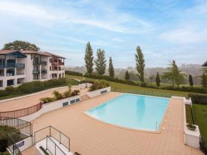 an image of a swimming pool at a resort at Apartment Les Terrasses d'Arcangues-4 by Interhome in Arcangues