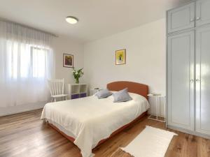 Postel nebo postele na pokoji v ubytování Apartment Laura by Interhome