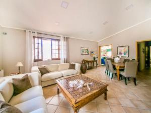 a living room with a couch and a table at Apartment Bouganville di Patrizia by Interhome in Castellammare del Golfo