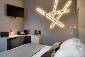 Un pat sau paturi într-o cameră la Mas de Boudan