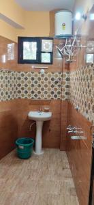 Ванная комната в Atithi Guest House