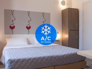 A bed or beds in a room at Lobby Collective Hostel - Lecce