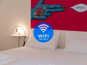 A bed or beds in a room at Lobby Collective Hostel - Lecce