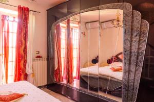 A bed or beds in a room at Alexander's Home
