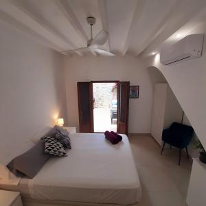 a bedroom with a large white bed with a ceiling at Casa Fénix in Altea