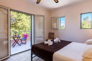 Ліжко або ліжка в номері Villa Dimitris Beach