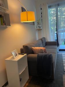 a living room with a couch and a table at RESET ul. Ratibora 66 in Jurata