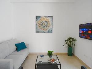 a living room with a couch and a table at Casa Fénix in Altea