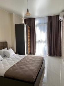 Postel nebo postele na pokoji v ubytování Horizons Hotel Rooms