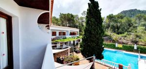 a view from the balcony of a hotel with a pool at Granada Apartments Familiar Deluxe in Portinatx