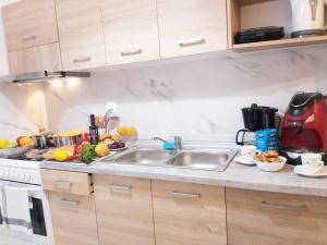 A kitchen or kitchenette at Angelina's cosy apartment in Corfu town
