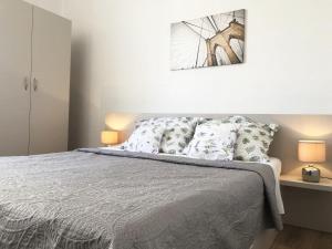 Posteľ alebo postele v izbe v ubytovaní Villy City Apartment