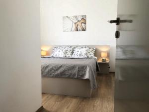 Posteľ alebo postele v izbe v ubytovaní Villy City Apartment