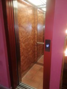 a shower with a glass door in a bathroom at El Jardín de la Alegría in Zamarramala