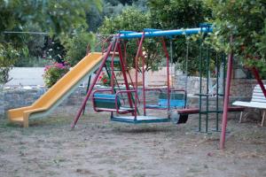 a playground with a slide at Rykinthos studios in Rodakino